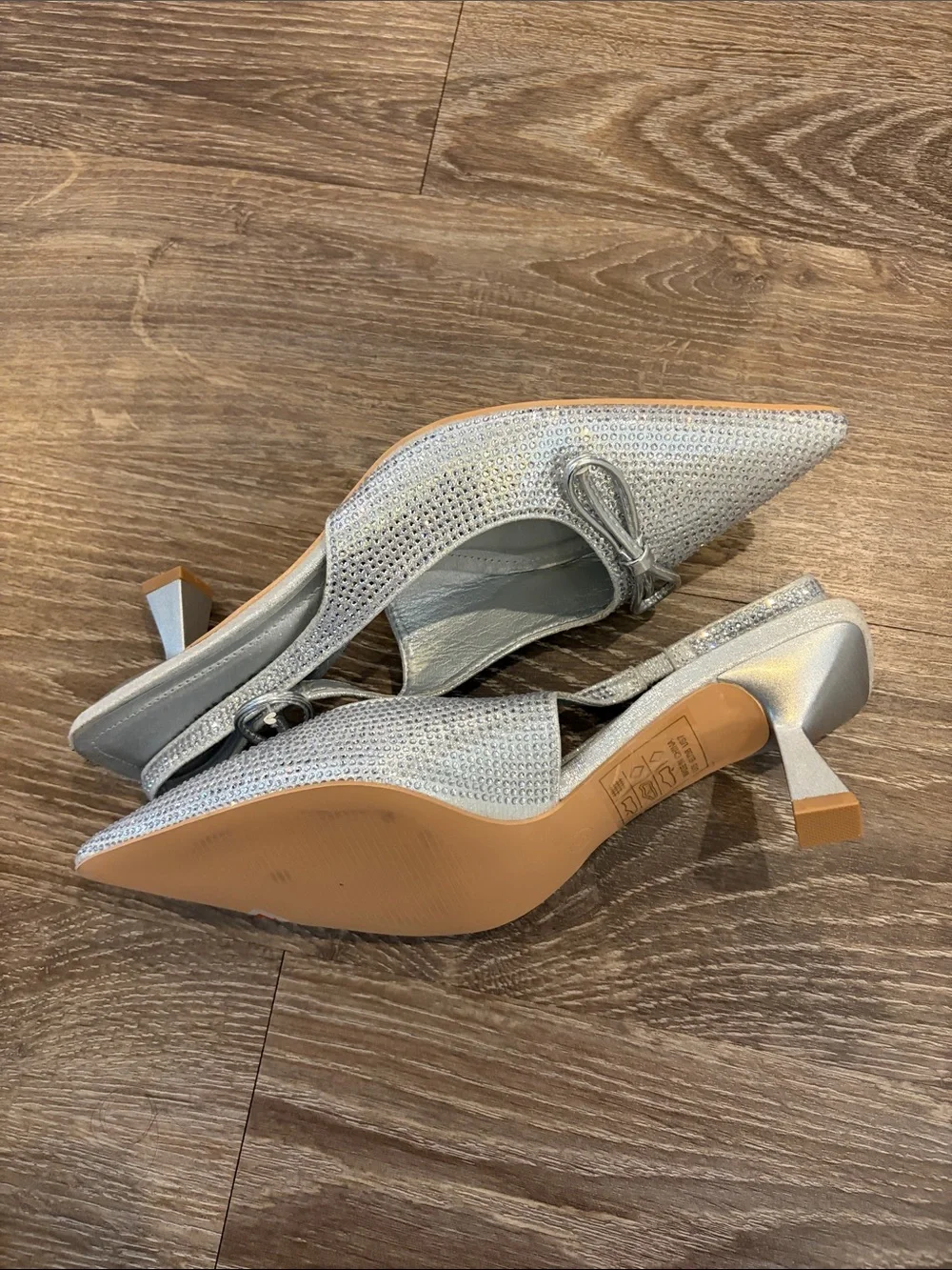Glamorous Silver Pointed Slingback Heels with Bow Accent